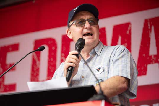Image:Nautilus general secretary Mark Dickinson outlines the Union's Fair Ferries campaign at a TUC 'We Demand Better' rally in June 2022. Image: Anna Gordon. 