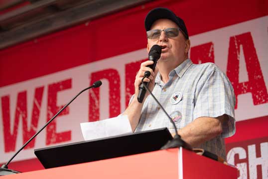 Image:Nautilus general secretary Mark Dickinson outlines the Union's Fair Ferries campaign at a TUC 'We Demand Better' rally in June 2022. Image: Anna Gordon