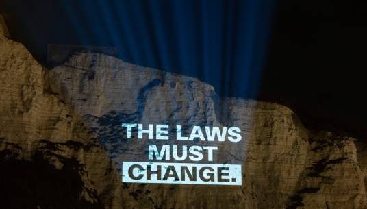 Image:Shortly after the P&O Ferries sackings in March 2022, unions teamed up to project a message of defiance onto the white cliffs of Dover. Image: ITF / ETF / Nautilus International / RMT
