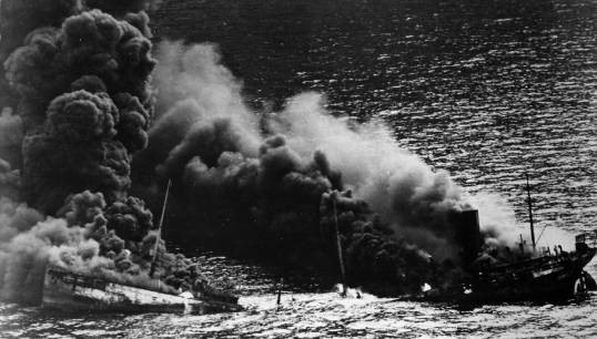 Image:Allied tanker being torpedoed during the Battle of the Atlantic. Image: BOAM/NARA