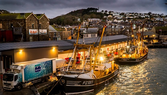 Image:2020's Ultimate Sea View winner Laurence Hartwell impressed with his photograph of beam trawlers landing to the fish market at night. Image: Shipwrecked Mariners' Society