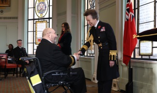 Image:Captain Mooney is congratulated by  HRH, The Princess Royal during the Medal ceremony.