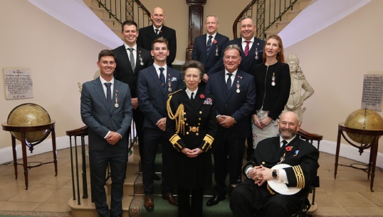 Image:HRH, The Princess Royal, with all nine 2024 Merchant Navy Medal recipients after the award ceremony at Trinity House. Images: Mark Dalton