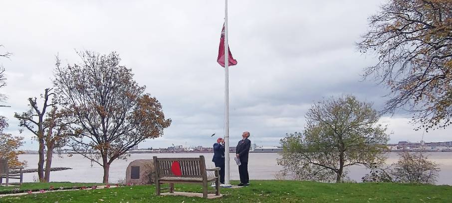 Image:The red ensign was lowered and raised during the Armistice Day ceremony at Nautilus Mariners' Park by resident Tony Wilson, a former chief officer on offshore heavy lift vessels. Image: Nautilus International