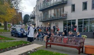 Image:Residents, family and staff gather outside the Trinity House Hub opposite the Atlantic Stone at the Park. Image: Nautilus International