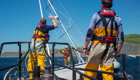Image:RNLI crew during a rescue. Image: Shipwrecked Mariners photo competition Twitter.