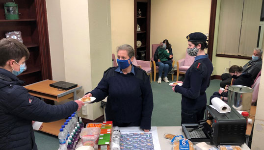 Image:Adult volunteer PO (SCC) Michelle Rae (middle) alongside two cadets AC Bronwyn and Cdt Siobhan serving up warm food and drink to those displaced by the storm. Image: Sea Cadets