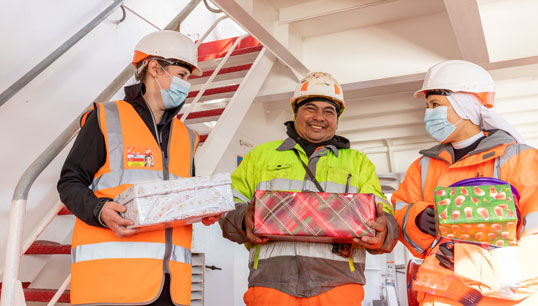 Image:Christmas shoe in: Bryony Watson (left) Stella Maris regional port chaplain for Immingham, and Sr Kathleen Redido (right) on a visit from Stella Maris Rome, present some of the Christmas 'shoebox' gifts to a seafarer in Immingham. All images: Stella Maris

