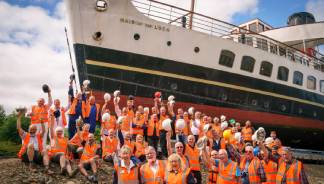 Image:Volunteers with the Maid of the Loch. Image: National Historic Ships UK