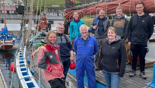 Image:Winner of the Individual Marsh Volunteer Award Ian Nicolson (middle) after a day of maintenance with others on historic fishing vessel the Swan. Image: National Historic Ships UK