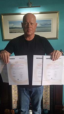 John_Scott_Agnew_with_his_renewed_certificates_web_insert.jpg