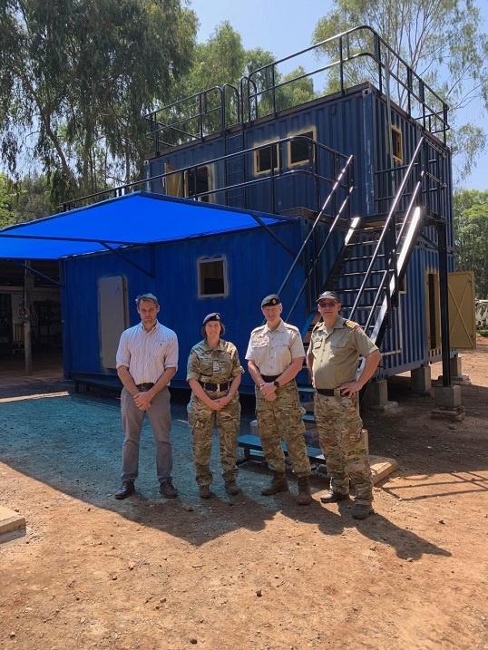 Image:Commander Karen Cahill and Danish colleagues outside the finished structure in Kenya. Image: South Shields Marine School