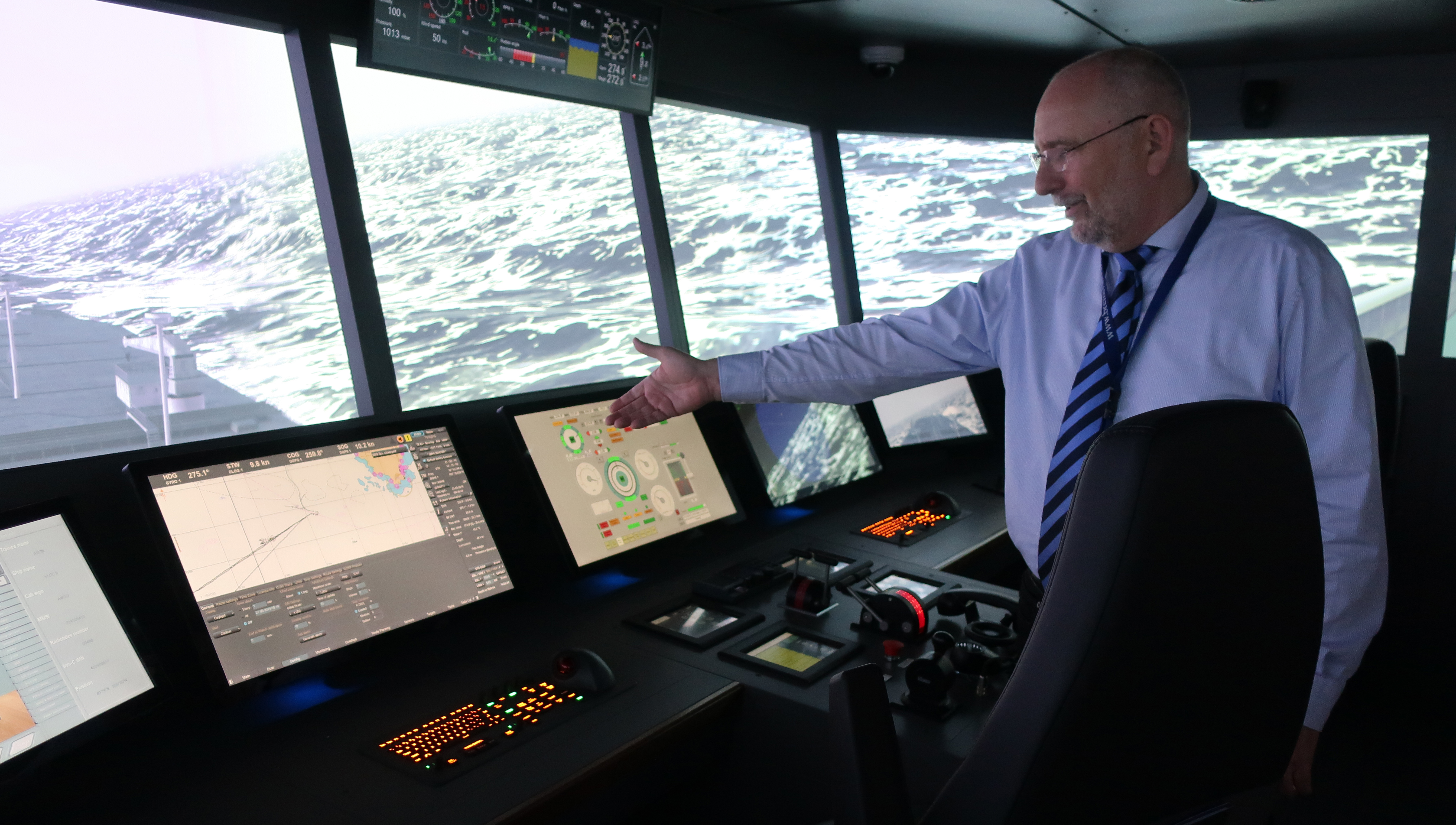Image:During the Warsash Association's tour, an instructor explains equipment layout on the 360 degree vision simulator. It was set for a VLCC in a heavy beam sea, 'so realistic it makes even experienced mariners fell a bit queasy.'