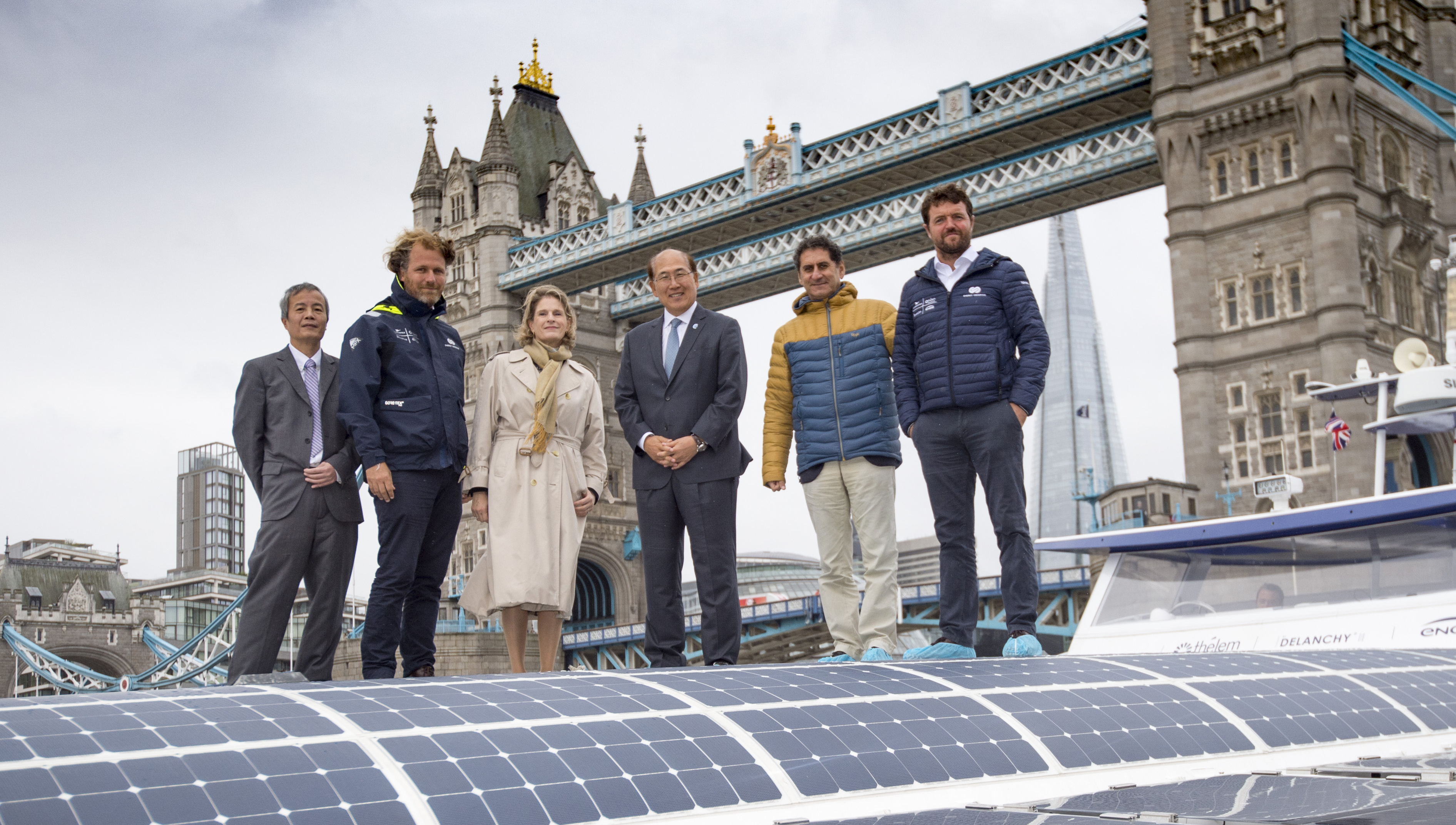 Image:Members of the expedition team and guests from the IMO at its London berth on the Thames, from left: Jérôme Delafosse, Geneviève Van Rossum, Kitack Lim, Francesco La Camera, Victorien Erussard, onboard the Energy Observer. Credit Lloyd Images