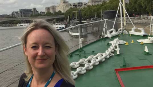 Image:Maritime UK's head of diversity and operations Chrissie Clarke visiting HQS Wellington in London. Image: Nautilus International