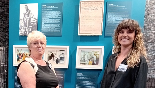 Image:1970s engineer officer Marion Pettigrew Sambridge (left) with her daughter Katy, flanking the photo of Marion in the Nautilus contribution to the She Sees exhibition, September 2023. Images: Nautilus International