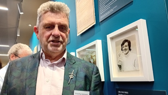 Image:Timothy Gascoyne, partner of the late Linda Craig Forbes, with Linda's picture in the She Sees exhibition 