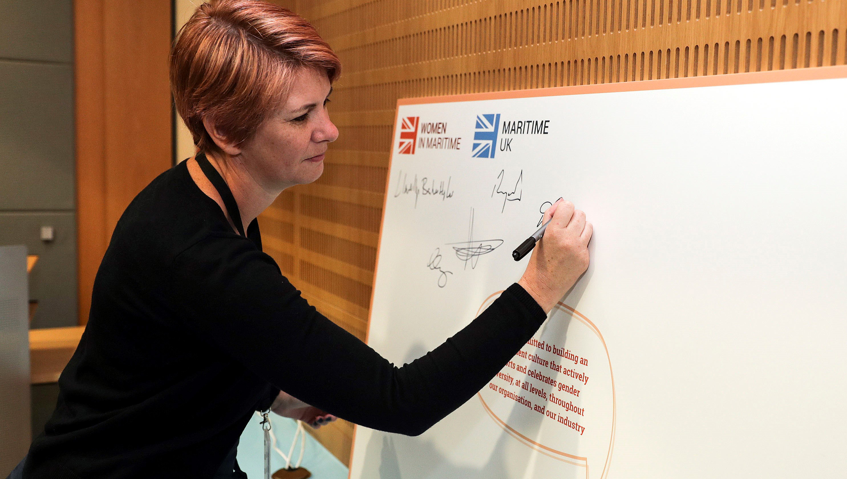 Image:Nautilus head of strategy Debbie Cavaldoro signs the pledge on behalf of the Union.