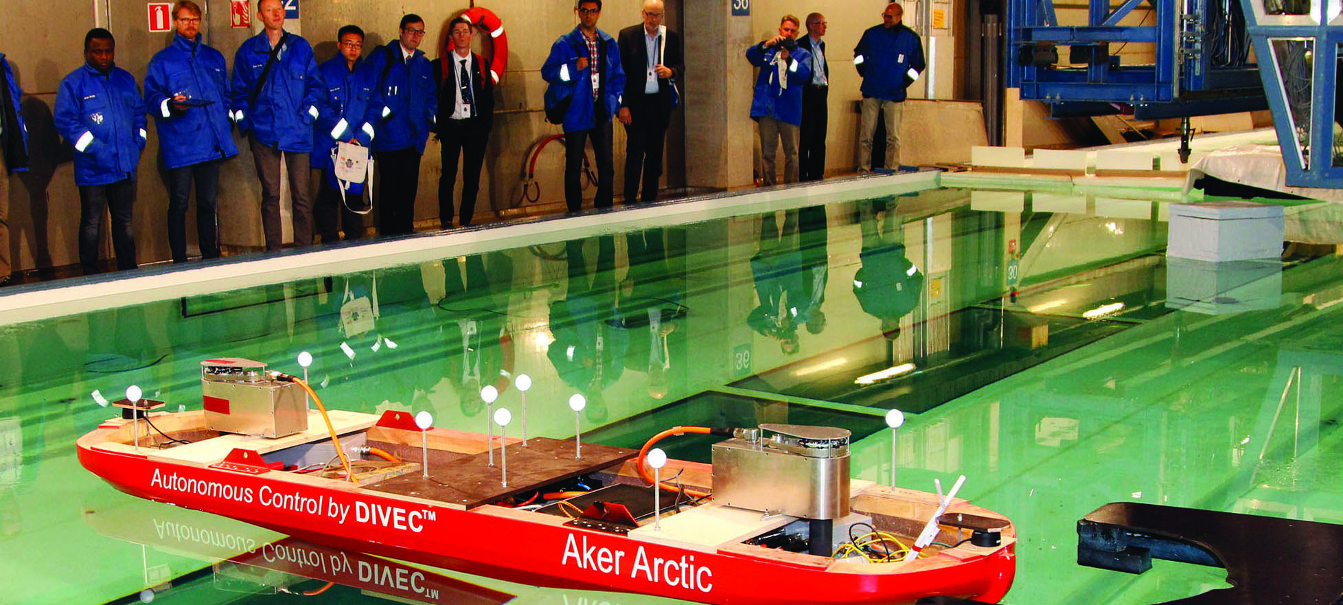 Image:The Finnish firm Aker Arctic has demonstrated an autonomous ship model – pictured – showing its ability to detect obstacles and manoeuvre around them without operator input.
The model vessel used onboard sensors to avoid the obstacles and to moor itself automatically to a target pier in Aker Arctic's test laboratory in Helsinki. The company said the tests were a step forward in the development of autonomous shipping and the technology used in the tests in the laboratory can be adapted to semi and full scale prototypes. 