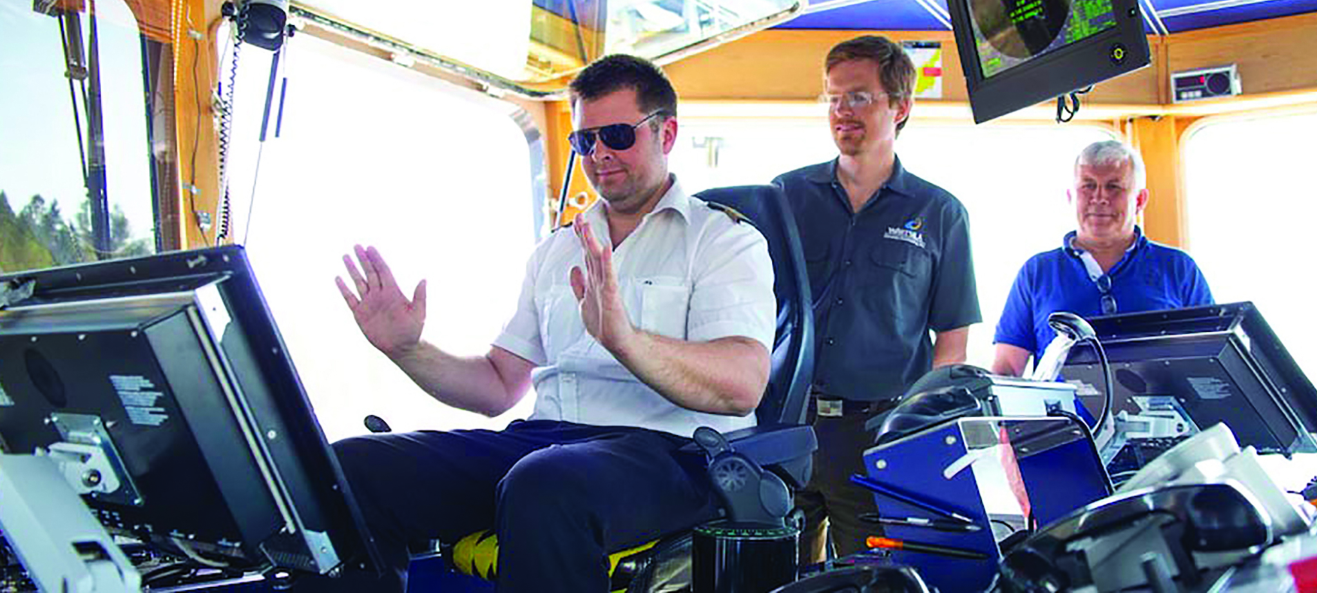 Image:Look no hands… pictured above are trials of a 'world-first autodocking' system being carried out onboard the 1,182gt Norwegian ferry Folgefonn earlier this year.
The system, developed by the technology group Wärtsilä, is based on dynamic positioning and cuts in some 2,000m from the berth, slowing the ship before activating the line-up and docking manoeuvre. It can also be used for automated departures from the berth, and manual intervention and control is possible at any time.
Wärtsilä said the system improves efficiency, saves fuel, reduces wear and tear on the engine, and improves safety. 'The automatic function allows the ship's officers to focus on situational awareness outside the wheelhouse, thereby improving the safety and reliability of the operations,' it added.
