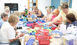 Image:Southampton Sailors Society volunteers packing in pre-pandemic days