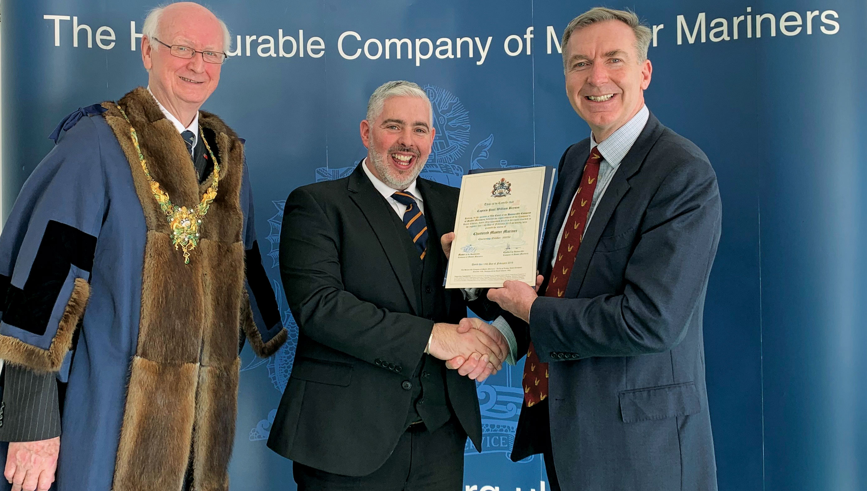Image:Captain Paul Bryson (centre) is among those awarded Chartered Master Mariner status