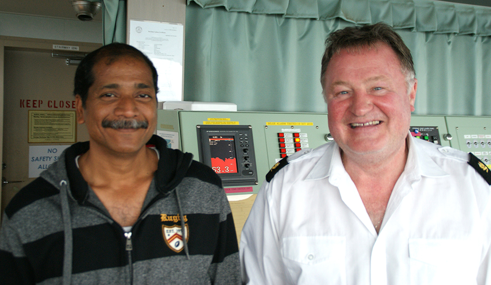 Title: deepsea pilot captain Paul Lanaghan and Cygnus Leader master Capt Subra Arumugam (left)