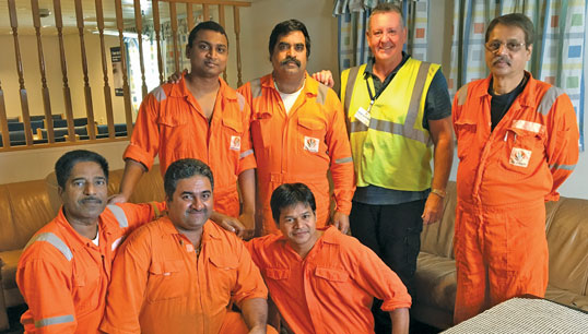 Image:Paul Keenan (in yellow hi-vis) in September 2016 with seafarers onboard the detained offshore supply vessel Malaviya Twenty. As ITF inspector for the east of England, Paul led the operation to arrest the vessel in Great Yarmouth, recover the wages owed and repatriate the crew. 