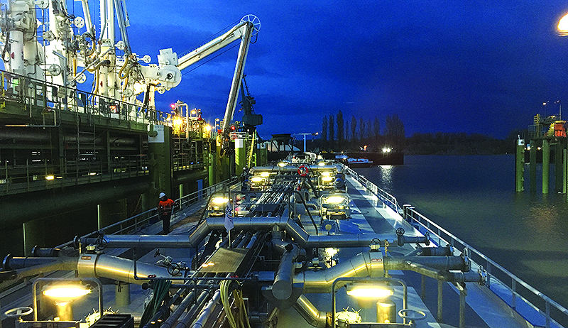Image: inland waterways loading heavy fuel oil at night - John Lang feature 