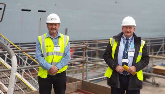 Image:RFA liaison officer Dave Gatenby (right) and Nautilus national organiser Steve Doran on a ship visit to RFA Wave Knight.