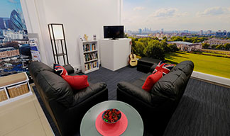 Image:After: There's now comfortable seating, a TV, books to read and a magazine stand
 