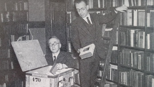 Image:Librarians from the Seafarers Education Service, which later merged with the Marine Society, packing hardback books to send to ships  Image: taken from In Cabined Ships at Sea by Ronald Hope 