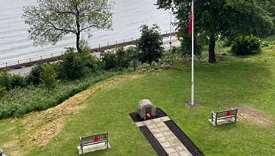 Image:The Atlantic Stone flanked by benches dedicated to Robert Prescott and Max Biggam. Image: Captain Peter Thomson
