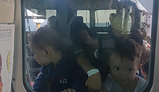 ross_cleland_migrant_rescue_kids_window.jpg
