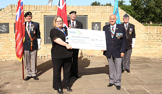 Image:Nautilus member Keith Thompson presents a cheque for £215 raised by his veterans' group to Sarah Oakden-Nancarrow of the National Memorial Arboretum