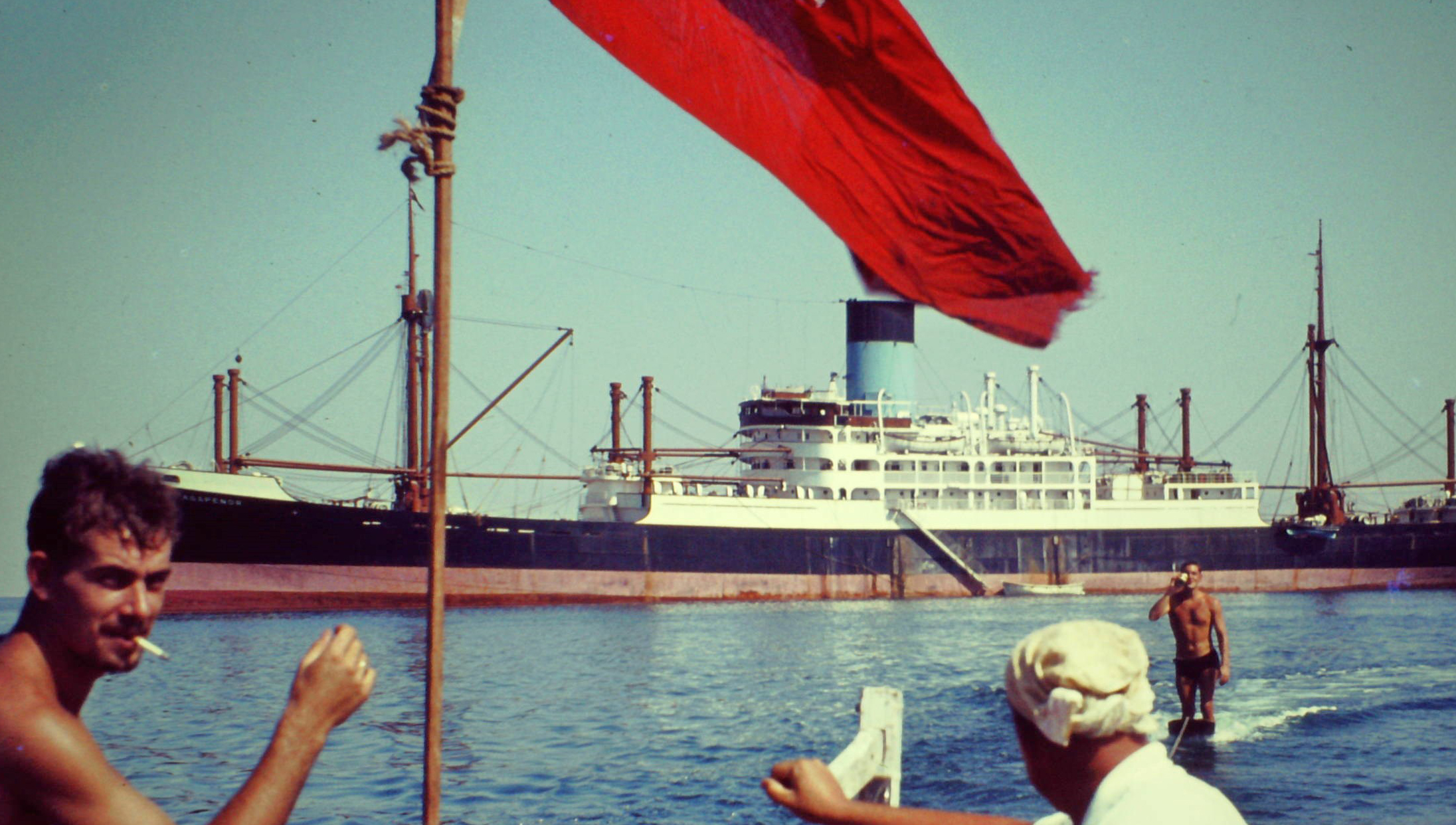 Image:'Surfboarding' on tow behind a lifeboat, with the Agapenor in the background. All images: Peter Flack