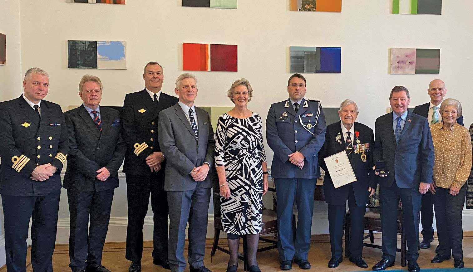 Image:Mr Hunter at the Norwegian embassy after being presented with the Norwegian King's Commemoratice Medal. L-R: Cdr Kenneth Zachariassen, Stephen Fry, Cdr Ragnar Johannessen, Cdr Nicholas Chatwin, Susan Keane, Colonel John Andreas Olsen, Donald Hunter, Ian Hunter, Keith Oakley, Barbara Oakley. Also present, Linda Oakley and Roger Round