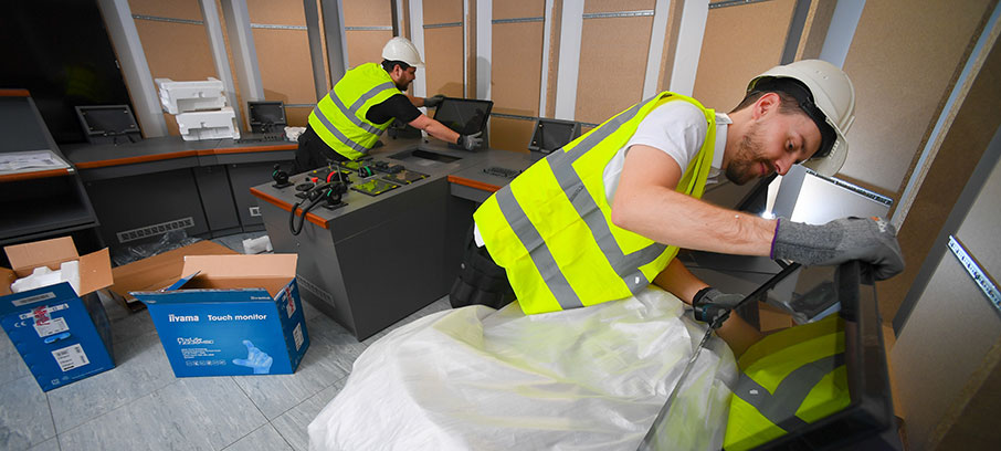 Image:The Wärtsilä team installing console screens for the new simulators