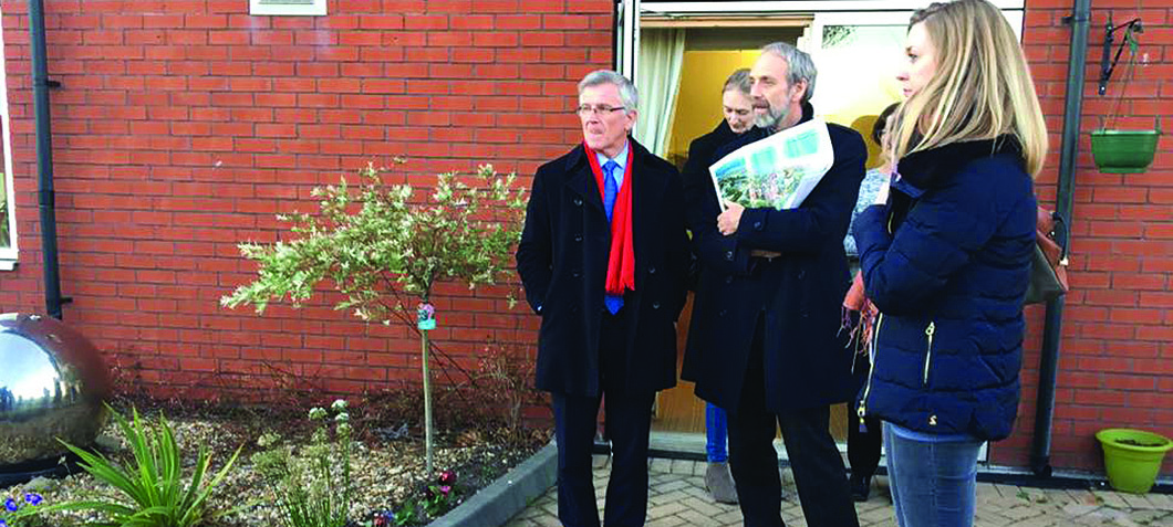 Image:Mick Howarth shows MNWB visitors the special garden at Mariners' Park which was purpose-built for residents affected by dementia.
