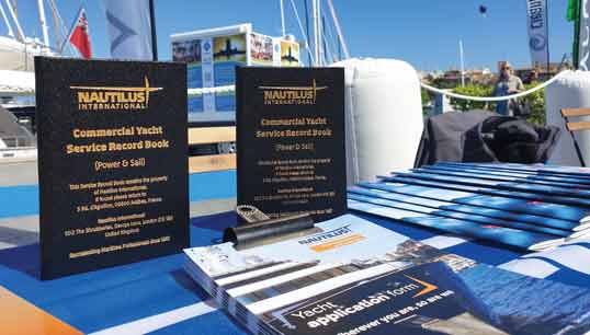 Image:Yacht service record books on display at a previous Palma Yacht Show.
