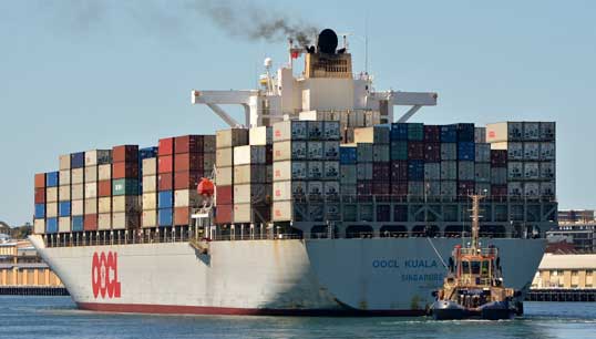 Image:The OOCL Kuala Lumpur container vessel entering Freemantle harbour in 2018. Image: Wikimedia Commons.