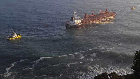 Image:Funing was towed to safety after engine failure left it drifting shortly after leaving the New Zealand port of Tauranga in July 2020.  Image: TAIC/Stu James via SunLive - Funing being assisted by Port of Tauranga tugs.

