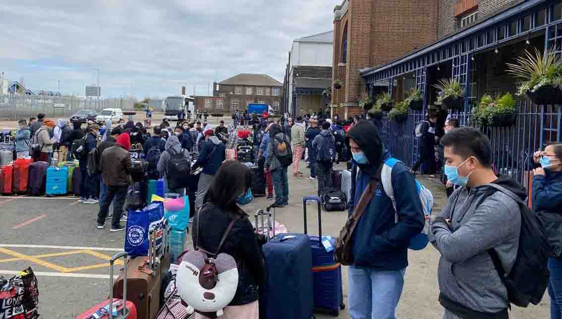 Image:Some of the cruise crew waiting at the Tilbury cruise terminal. Image: QVSR