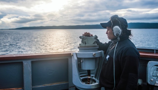 Image:Navigating away from agression: researchers emphasised that 'more effort needs to be made by the industry and public authorities to address the low levels of awareness among seafarers on the procedures to follow if they are suffering workplace harassment.' Image: Wikimedia Commons/US Navy sailor takes bearings