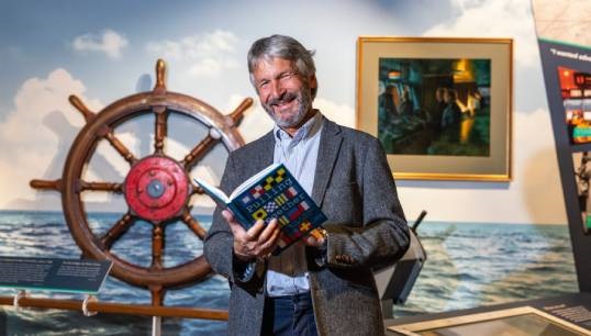 Image:Andrew Linington with the Nautilus history book Pulling Together: The Making of a Global Maritime Trade Union, which was launched at the 2023 General Meeting. Images: Brad Wakefield