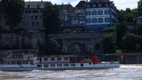 Image:The Hafenmuseum in Basel is holding an exhibition on 100 years of the  Swiss Rhine boatmaster's licence. Image: Swiss-flagged vessel on the River Rhine/Wikimedia Commons.