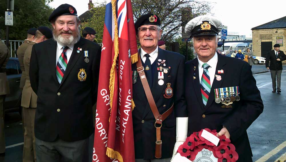 Image: At the Cenotaph in Hull during Remembrance Sunday 2019 L-R: HMS Cardiff radio operator Paul Harmer; Norland standard bearer Ron Barley; and Nautilus member Keith Thompson MNM