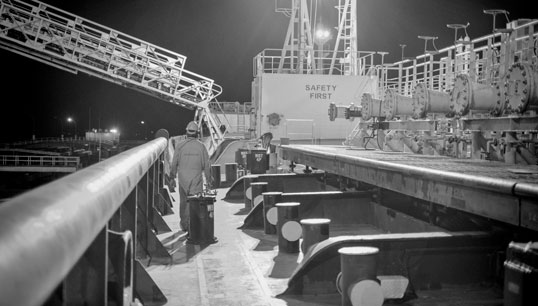 Image:Cargo operations during the pandemic, part of the Exposure: Lives at Sea exhibition at the National Maritime Museum, London. Image: used by permission of the artist (c) Cezar Gabriel.