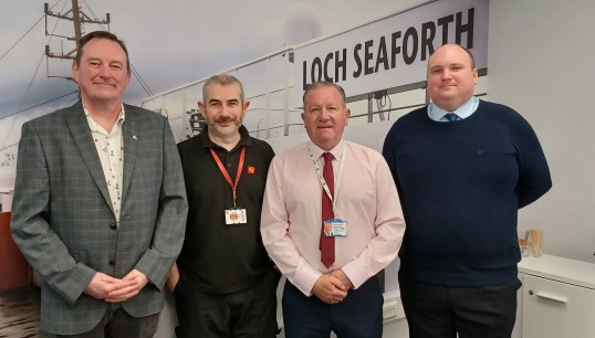 Image:Liaison officers Iain MacKenzie, Allan Dickson and James Christie with Nautilus head of industrial Micky Smyth (second from right) during the negotiations. Image: Nautilus International