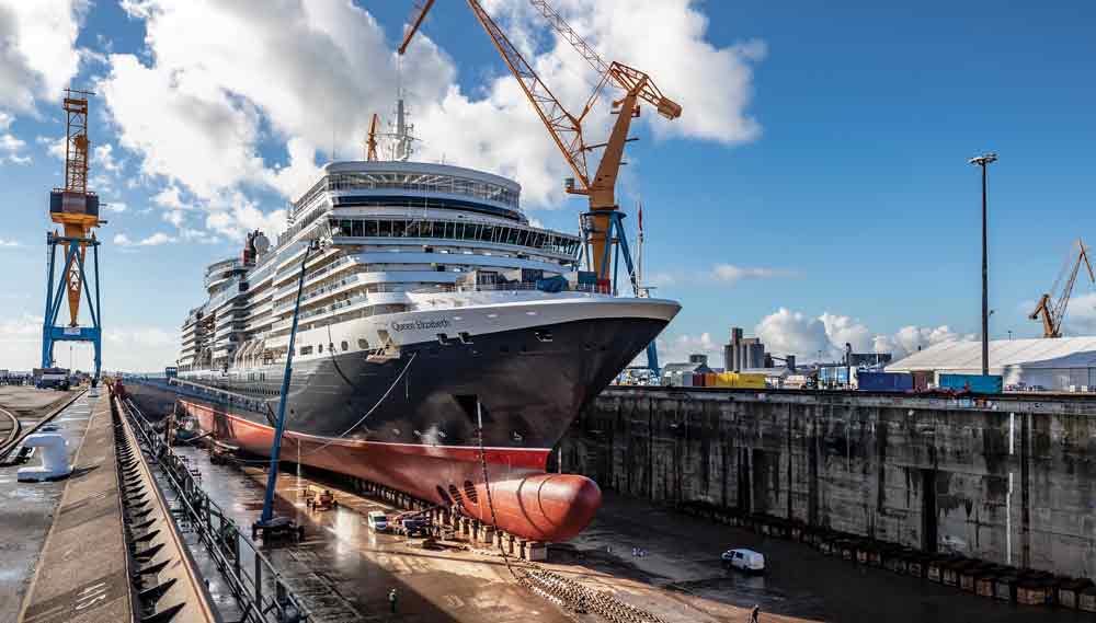 Image:Cunard cruiseship Queen Elizabeth's entire Alaska season and all departures up to and including September 8 have been cancelled. Image:In dry dock for a refit at French Ship repair yard in 2019.